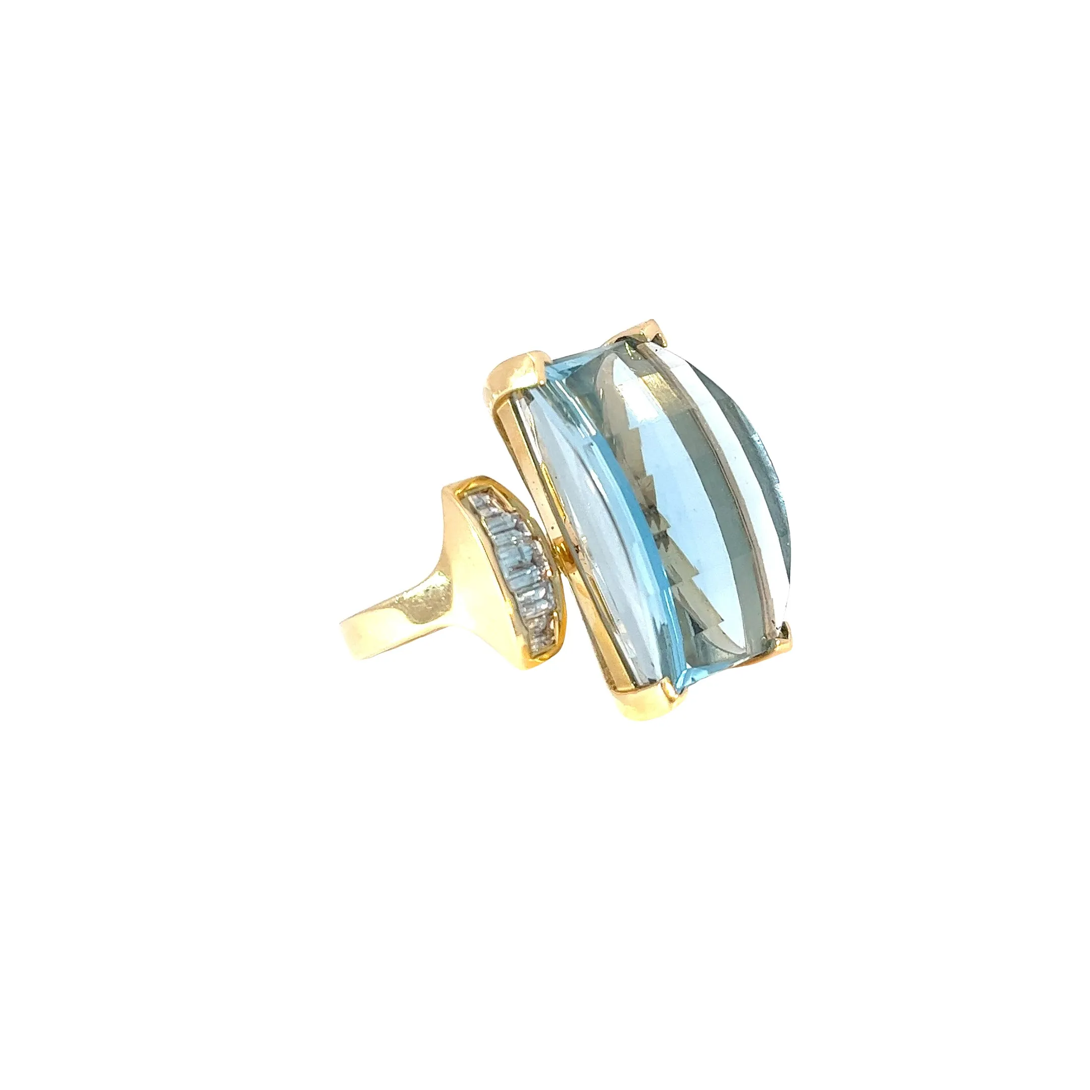 14k Yellow Gold 38.00ct  Emerald Cut  Blue Topaz and .85ct G SI1 Baguette shaped Diamond ring